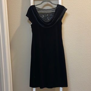 Black party dress with drape collar and beaded net inserts front and drop back